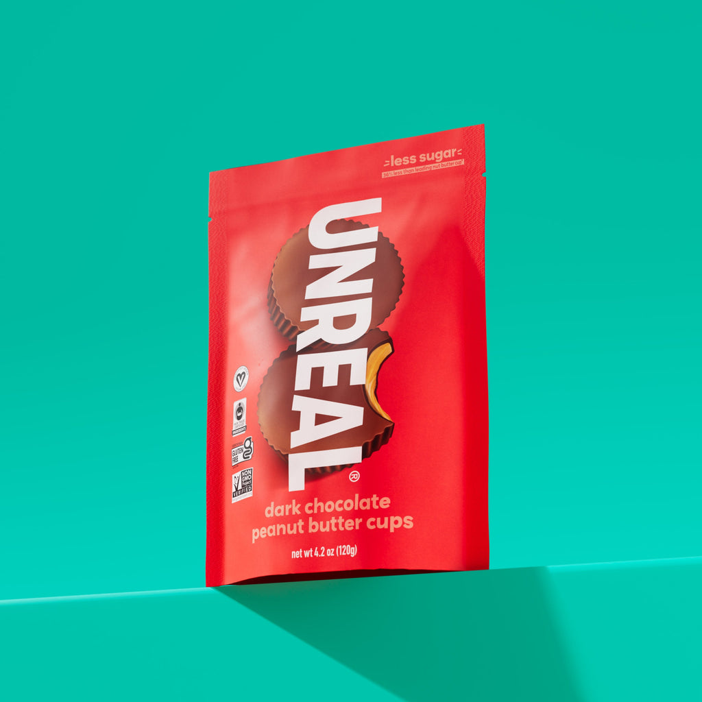 UNREAL dark chocolate peanut butter cups package with less sugar claim and certification logos