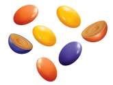 Top view of Peanut Butter Drops with glossy colored shells and halved pieces revealing peanut butter filling